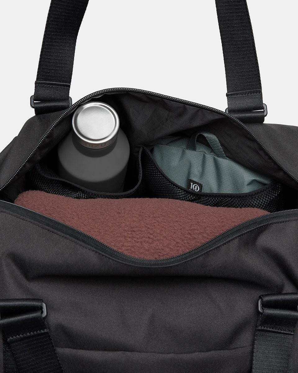 Black-Sustainable-Water-Resistent-Duffle-Bag-TAU5813-0164_6_a01e58dc-0cf9-4a85-aff4-0642d2e65d36 - PreLoved & Luxe