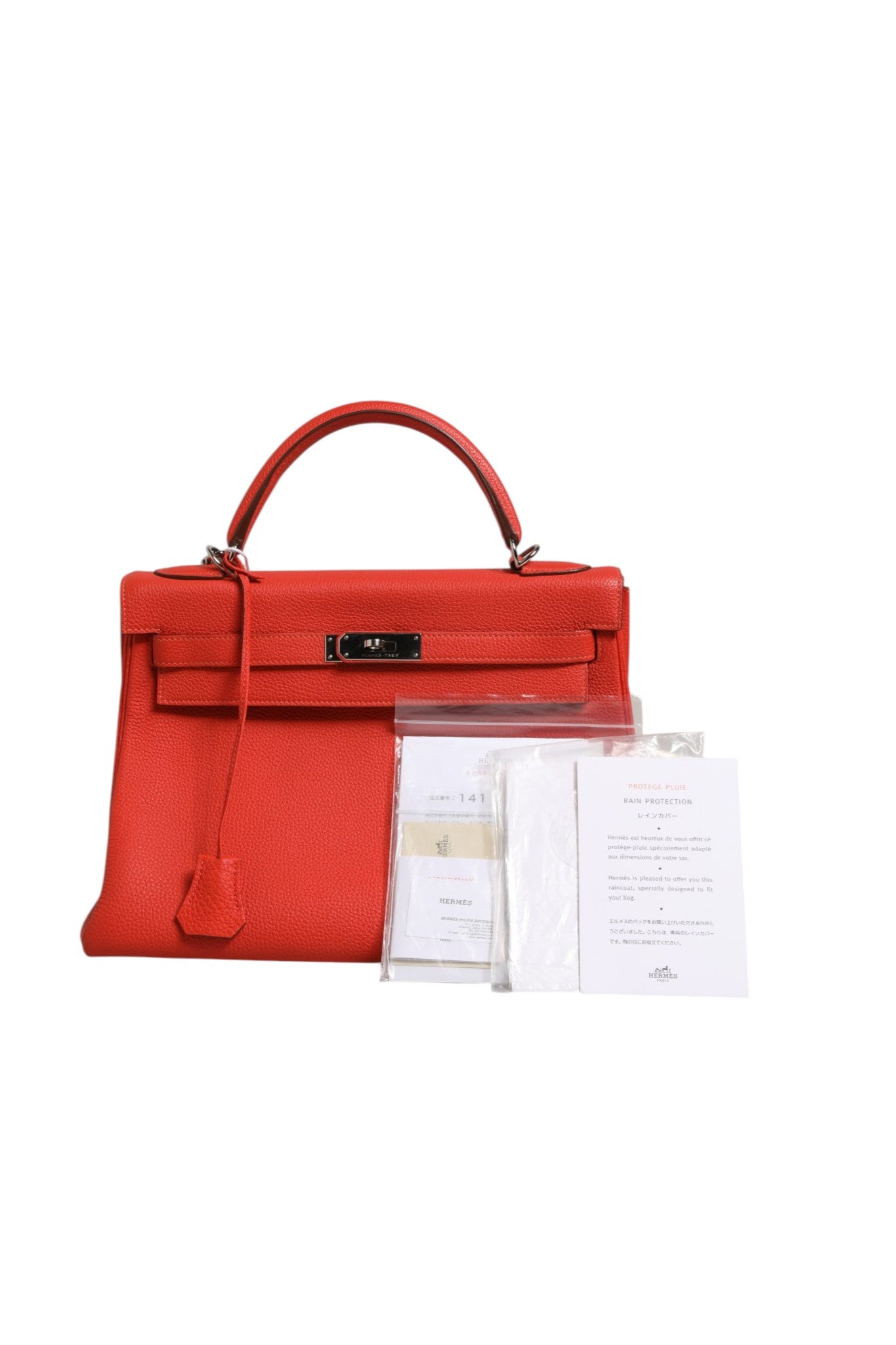 Hermès Kelly 32 Retourne Two-Way Handbag in Vibrant Orange Leather